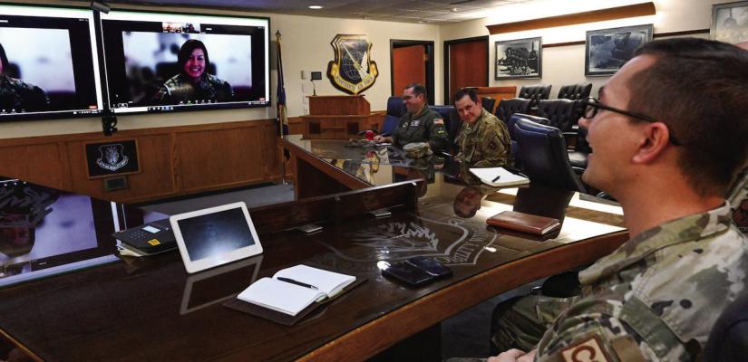 U.S. Air Force Tech. Sgt. Connor Bish, 97th Air Mobility Wing noncommissioned officer in charge of command and control operations, speaks to Chief Master Sgt. of the Air Force JoAnne S. Bass over a video call at Altus Air Force Base, Oklahoma, Nov. 21, 2023. Bish was hand selected by Bass to enter the Senior Leader Enlisted Commissioning Program - Active Duty. U.S. Air Force photo by Senior Airman Miyah Gray